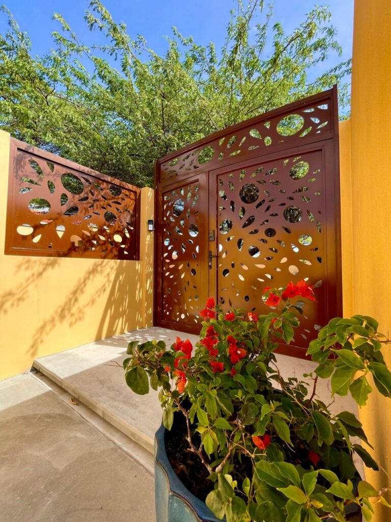 Custom artistic metal gate designed by Infinite Crafts in Aruba, perfect for enhancing outdoor entrances with style and security.