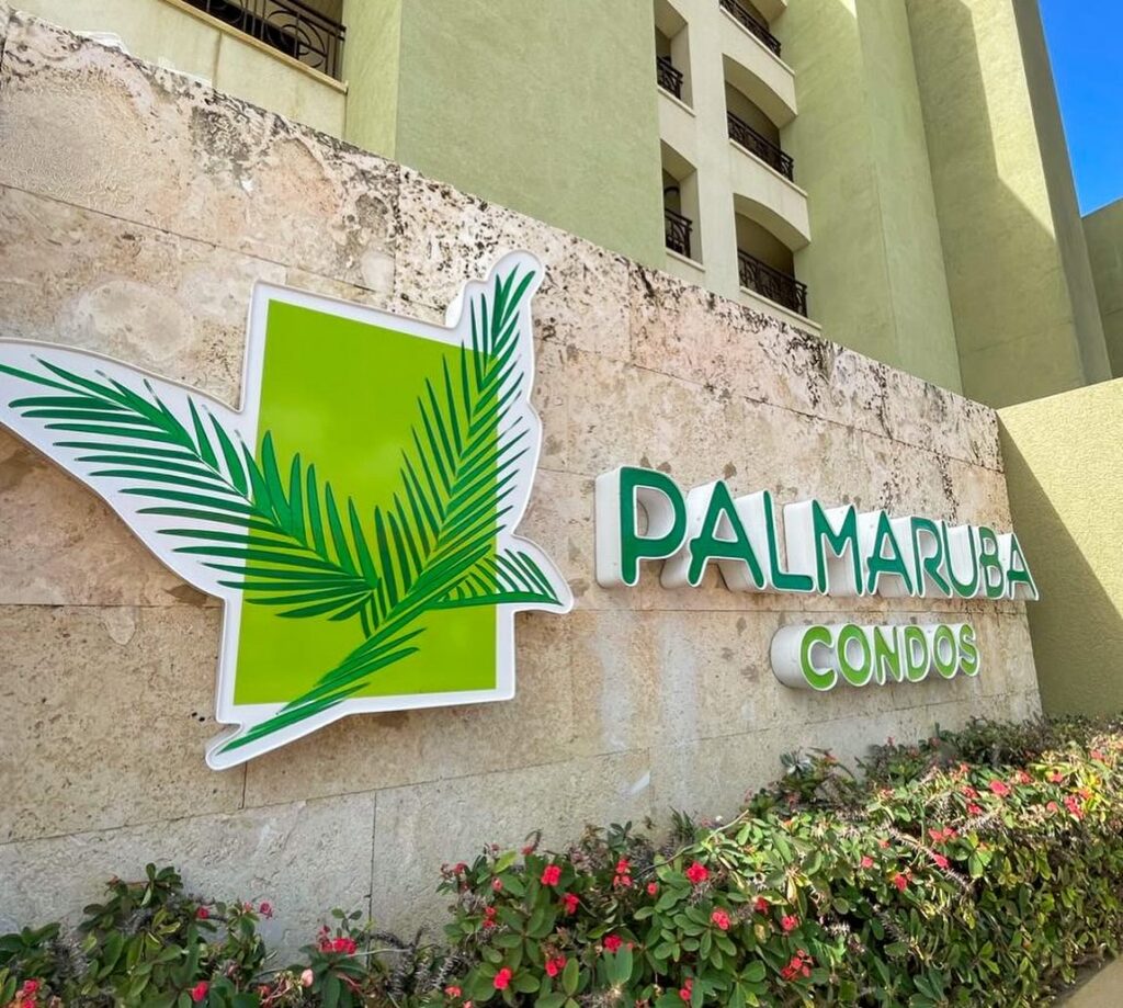 Front-illuminated channel letter sign for Palmaruba Condos, crafted by Infinite Crafts in Aruba.